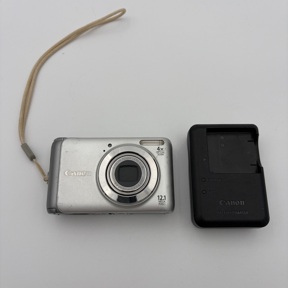 Canon PowerShot A3100 IS Camera Silver w/ Battery Charger Well Loved
